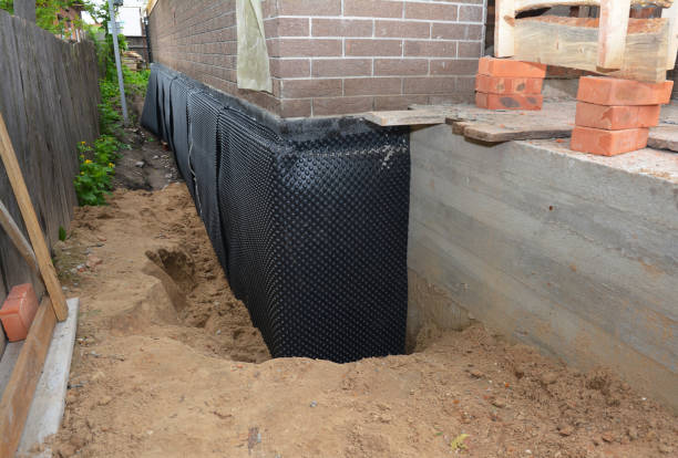 Happy homeowners after waterproofing job in Lockport